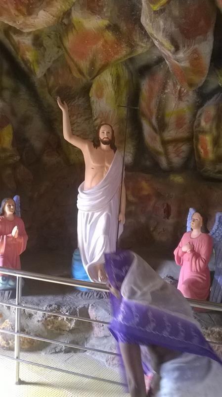 A sculpture view of Jesus with Cross as seen in Pinakadimi, Eluru, A.P, India