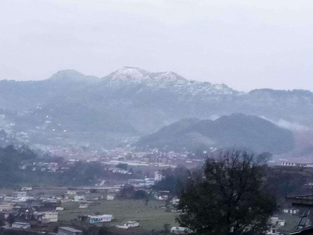 Snow covered hills in the background of Pithoragarh town (Jan18)